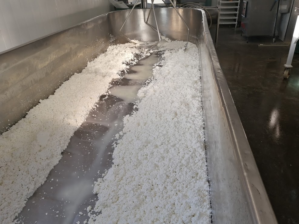 How cheese is made. Draining of the whey.